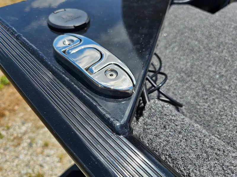 Slide: The Image of 2025 Tracker Bass Tracker Classic XL boat detail with chrome hardware and carpeted surface. - 20