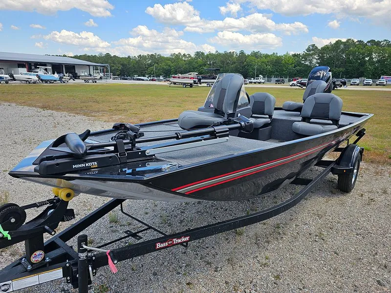 Slide: The Image of 2025 Tracker Bass Tracker Classic XL boat on trailer, parked outdoors under a cloudy sky. - 5