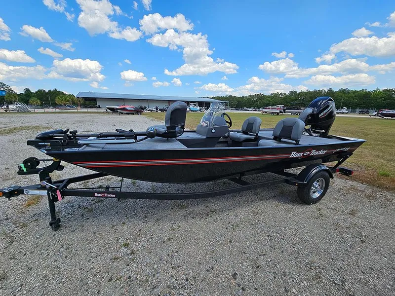 Slide: The Image of 2025 Tracker Bass Tracker Classic XL boat on trailer under blue sky. - 6