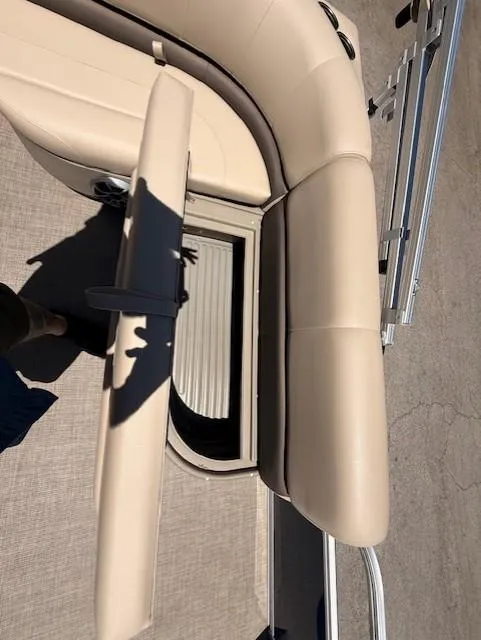 Slide: The Image of 2025 Sun Tracker Bass Buggy 16 XL Select boat seat with storage compartment open. - 10