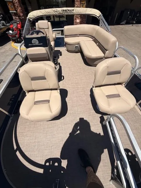 Slide: The Image of 2025 Sun Tracker Bass Buggy 16 XL Select pontoon boat with beige seating and spacious deck. - 7