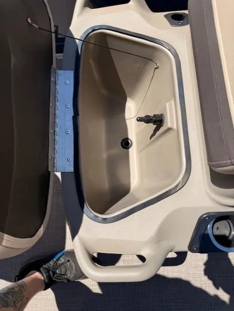 Slide: The Image of Open storage compartment on a 2025 Sun Tracker Bass Buggy 16 XL Select boat. - 8