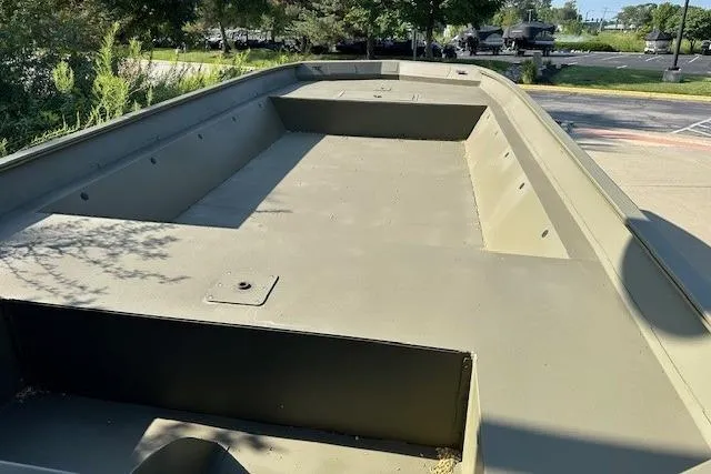 Slide: The Image of 2025 Tracker GRIZZLY 2072 Utility boat, spacious deck, parked outdoors. - 2