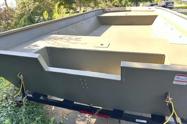 Slide: The Image of 2025 Tracker GRIZZLY 2072 Utility boat, empty interior, on trailer, outdoors. - 4