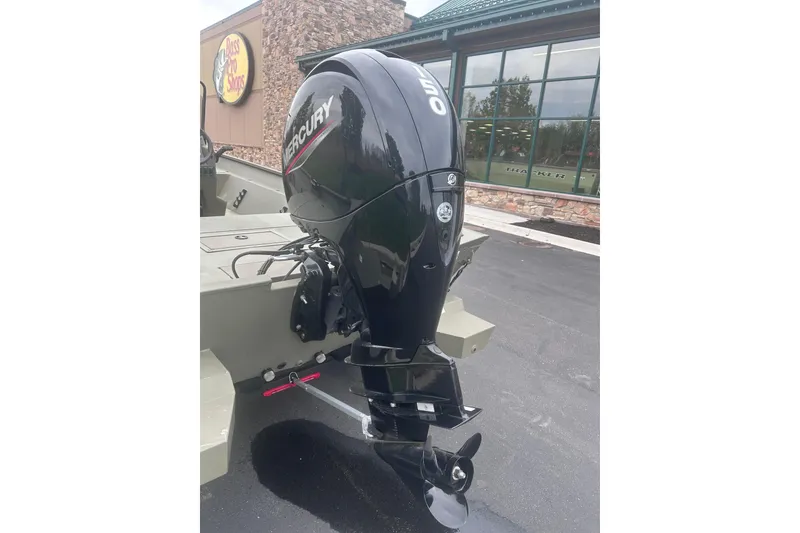 Slide: The Image of 2024 Tracker Grizzly 2072 CC boat with Mercury 150 outboard motor at Bass Pro Shops. - 11