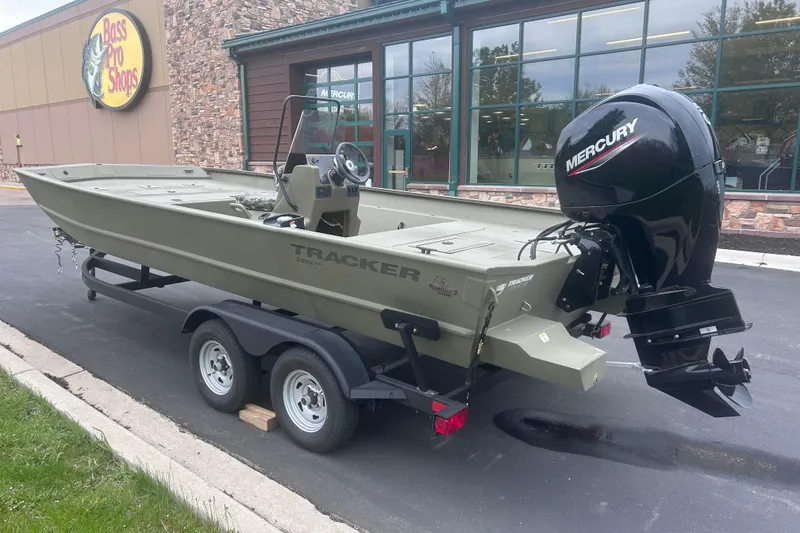 Slide: The Image of 2024 Tracker Grizzly 2072 CC boat with Mercury engine outside Bass Pro Shops. - 12