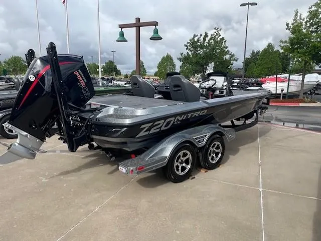 Slide: The Image of 2025 Nitro Z20 XL Pro boat on trailer, parked outdoors, showcasing sleek design and powerful engine. - 3