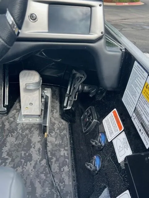 Slide: The Image of Interior of 2025 Nitro Z20 XL Pro boat with control panel and foot pedal. - 7