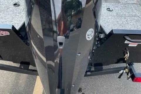 Slide: The Image of 2025 Tracker Pro Guide V-16 SC boat, rear view, on a trailer. - 3