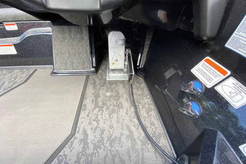Slide: The Image of Interior of 2025 Nitro Z20 XL Pro boat showing foot pedal and control panel. - 10