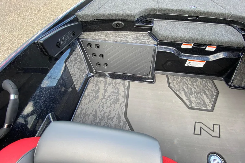 Slide: The Image of 2025 Nitro Z20 XL Pro boat interior with textured flooring and storage compartments. - 11