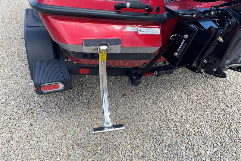 Slide: The Image of Rear view of a 2025 Nitro Z20 XL Pro boat on a gravel surface. - 19