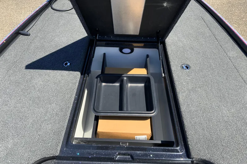 Slide: The Image of Open storage compartment in 2025 Nitro Z20 XL Pro boat, featuring organized interior space. - 21