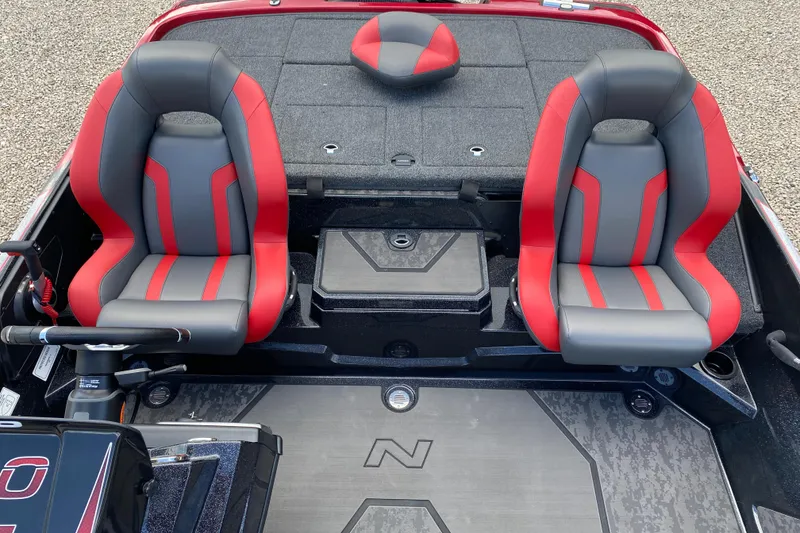 Slide: The Image of 2025 Nitro Z20 XL Pro boat interior with red and gray seats, steering wheel, and deck. - 5