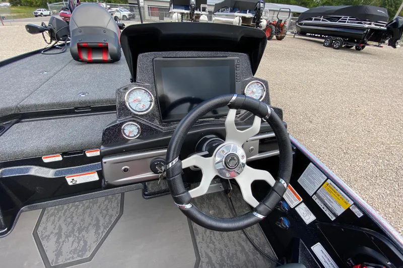 Slide: The Image of 2025 Nitro Z20 XL Pro boat dashboard with steering wheel and digital display. - 8