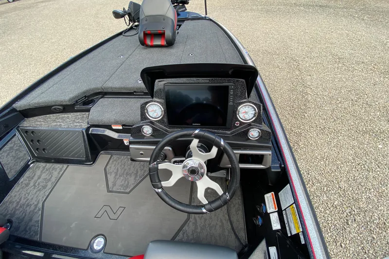 Slide: The Image of 2025 Nitro Z20 XL Pro boat cockpit with steering wheel and digital display. - 9