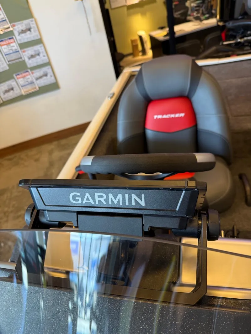 Slide: The Image of 2025 Tracker Savage 215 boat with Garmin navigation system and comfortable seating. - 5