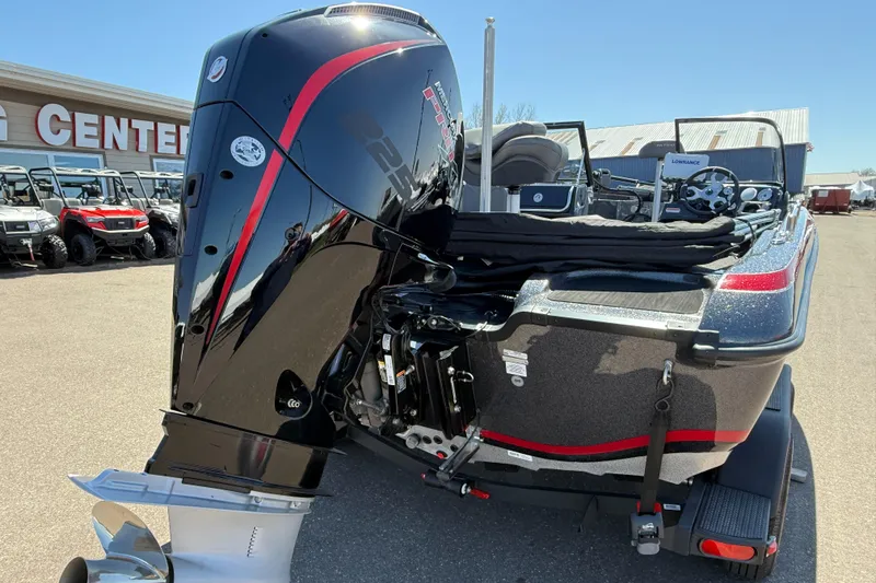 Slide: The Image of 2024 Nitro ZV19 Sport Pro boat with powerful outboard motor, parked outdoors. - 10