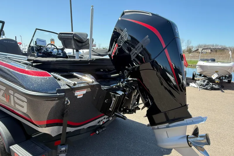 Slide: The Image of 2024 Nitro ZV19 Sport Pro boat with powerful outboard motor, sleek design, and red accents. - 11