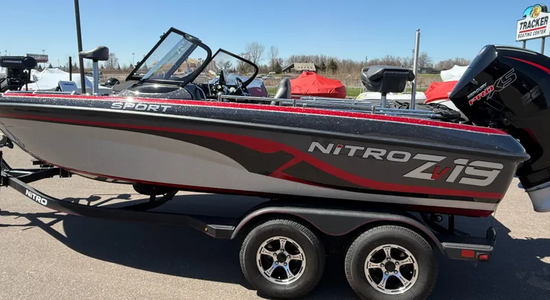 Slide: The Image of 2024 Nitro ZV19 Sport Pro boat on trailer, side view, outdoors. - 2