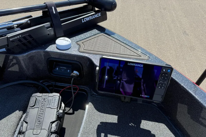 Slide: The Image of 2024 Nitro ZV19 Sport Pro boat dashboard with Lowrance electronics and controls. - 6
