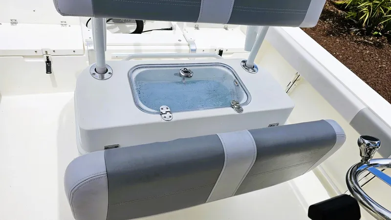 Slide: The Image of 2024 Mako 214 CC boat interior with seating and livewell. - 12
