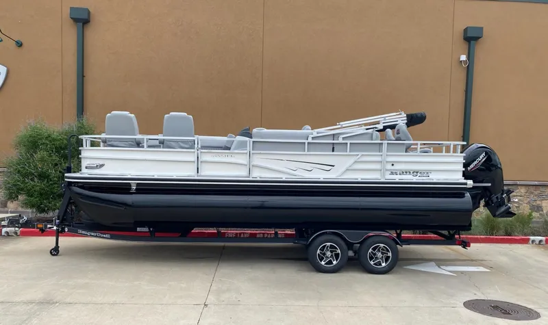 The Image of 2025 Ranger Reata 223FC pontoon boat on a trailer, parked outdoors. - 0