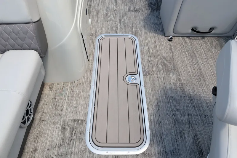Slide: The Image of 2025 Ranger Reata 223FC boat interior with sleek flooring and seating. - 10