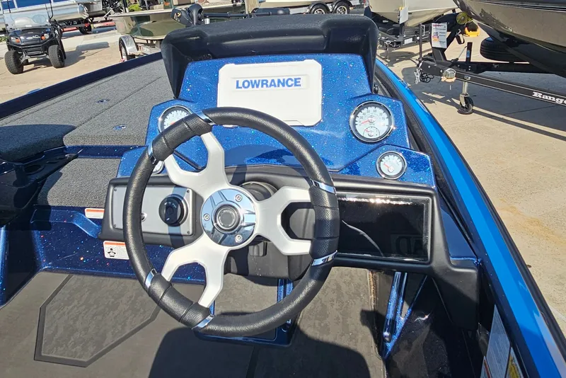 Slide: The Image of 2025 Nitro Z21 XL boat dashboard with steering wheel and Lowrance display. - 9