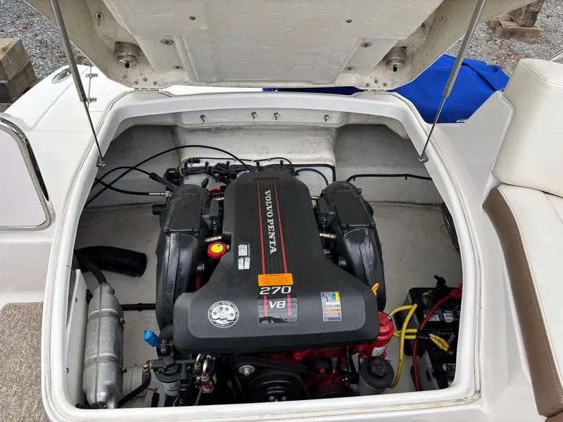 Slide: The Image of Engine compartment of a 2014 Chaparral 224 Sunesta boat, featuring a Volvo Penta V8 engine. - 10