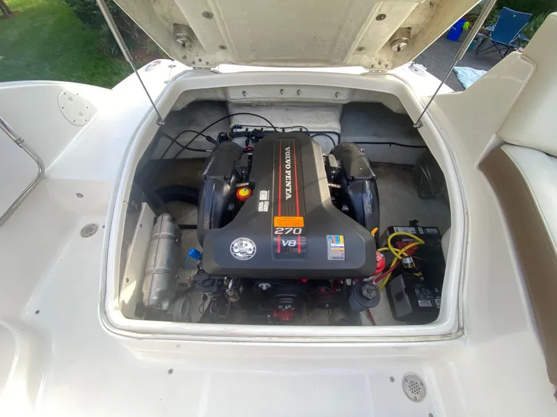 Slide: The Image of 2014 Chaparral 224 Sunesta boat engine compartment with V8 engine visible. - 11