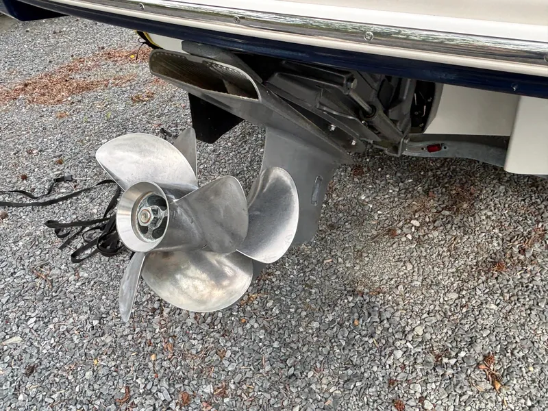 Slide: The Image of 2014 Chaparral 224 Sunesta boat propeller on gravel surface. - 14