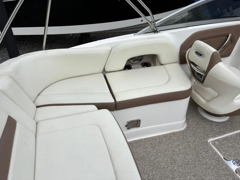 Slide: The Image of 2014 Chaparral 224 Sunesta boat interior with white and brown seating. - 21