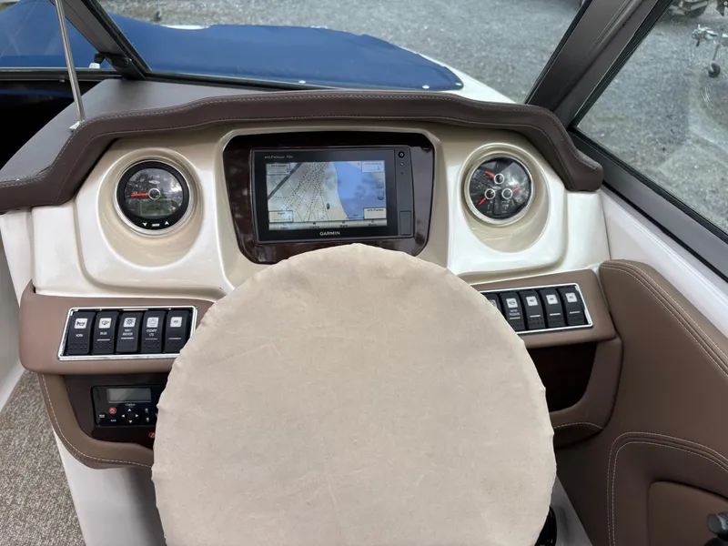 Slide: The Image of Dashboard of 2014 Chaparral 224 Sunesta boat with GPS and gauges. - 26