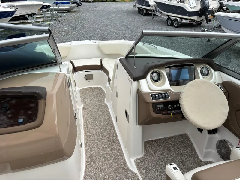 Slide: The Image of 2014 Chaparral 224 Sunesta boat interior with steering wheel and dashboard. - 29