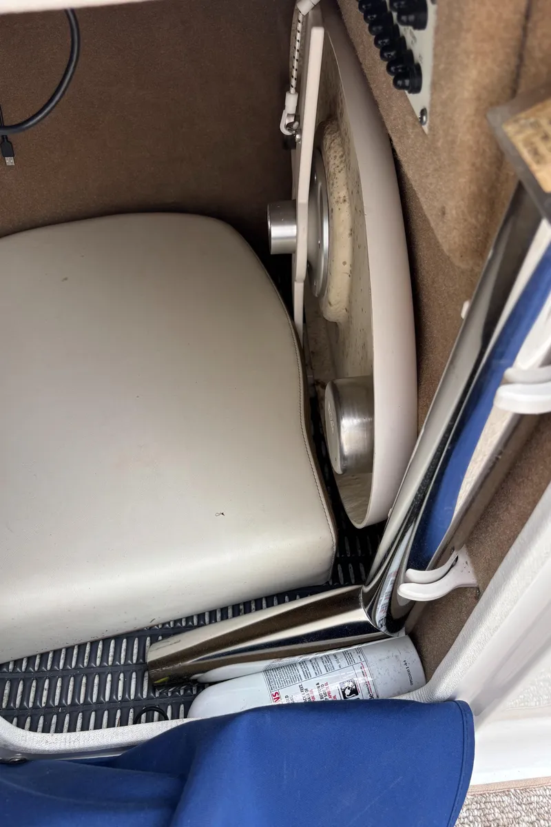 Slide: The Image of 2014 Chaparral 224 Sunesta interior detail, featuring seating and storage area. - 36