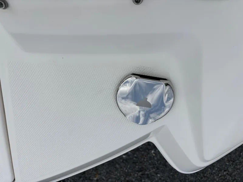 Slide: The Image of Close-up of a 2014 Chaparral 224 Sunesta boat's chrome fuel cap. - 38