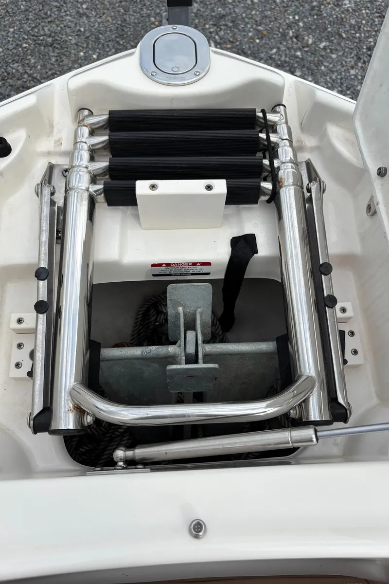 Slide: The Image of 2014 Chaparral 224 Sunesta boat ladder and anchor storage area. - 39