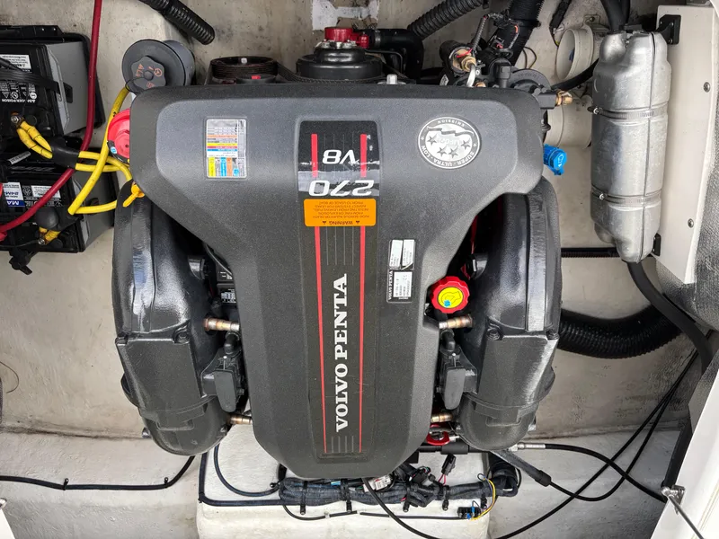 Slide: The Image of Volvo Penta engine in 2014 Chaparral 224 Sunesta boat, showcasing powerful marine performance. - 8