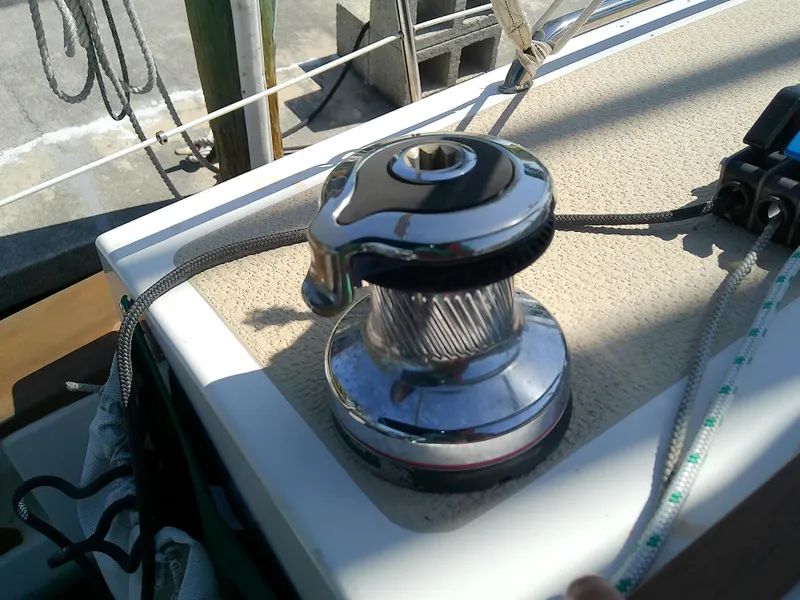 Slide: The Image of Winch on 2017 Com-Pac 27/3 sailboat deck, with ropes and hardware. - 16