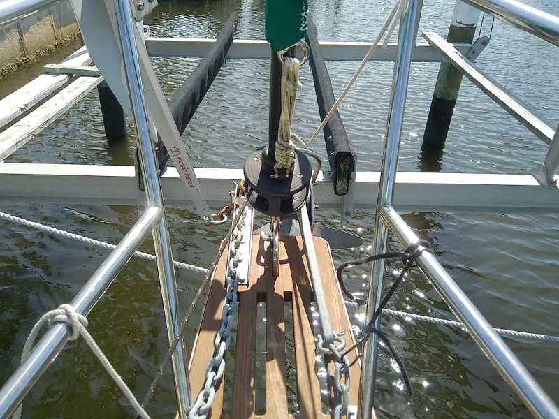 Slide: The Image of Bow of 2017 Com-Pac 27/3 sailboat with anchor chain and dock view. - 9
