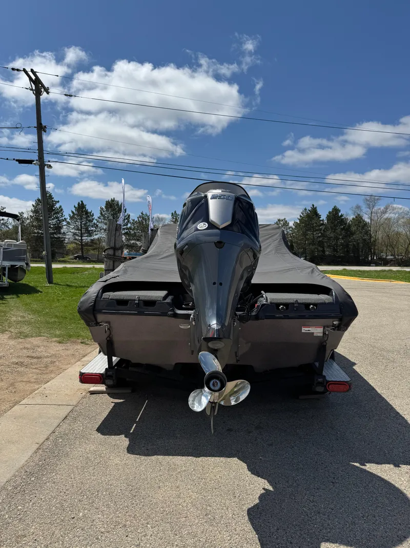 Slide: The Image of 2022 Skeeter Solera 205 boat with cover, parked outdoors on a sunny day. - 3