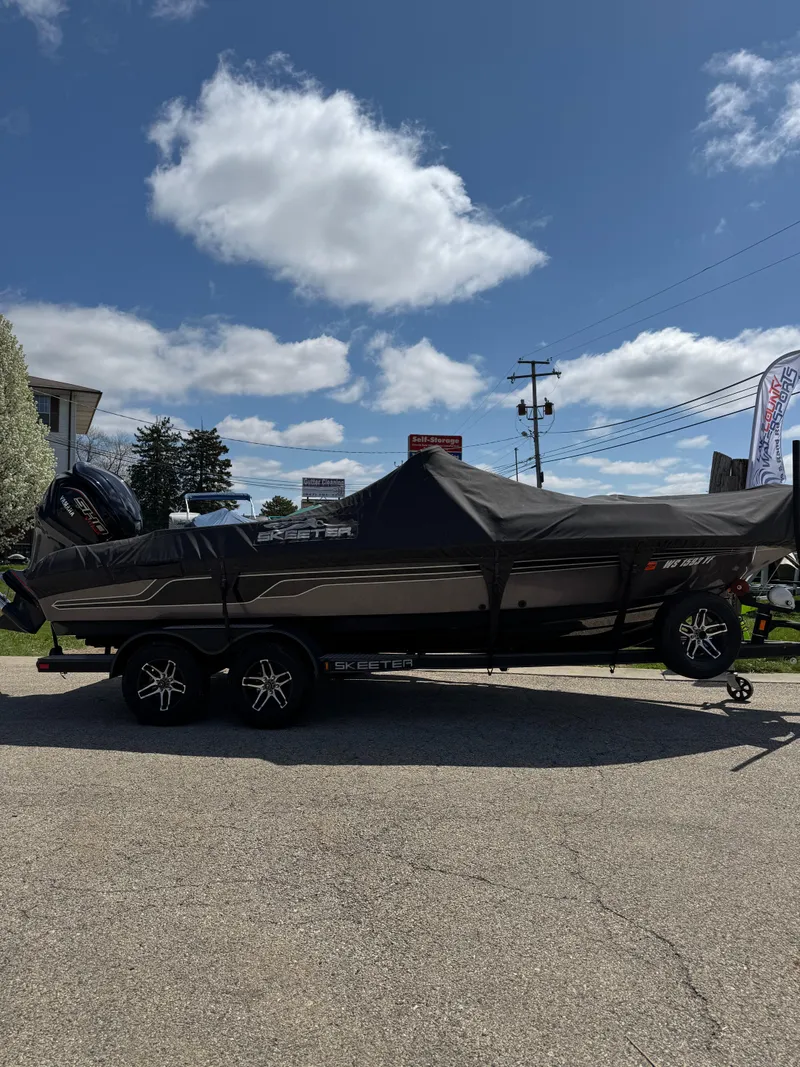 Slide: The Image of 2022 Skeeter Solera 205 boat with cover and outboard motor on trailer. - 4