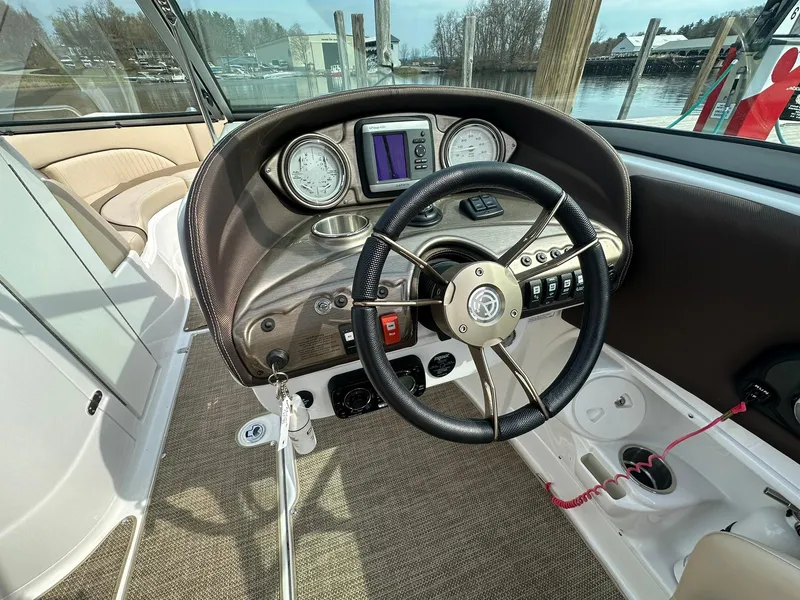 Slide: The Image of 2014 Cruisers Sport Series 278 Bow Rider dashboard with steering wheel and gauges. - 12