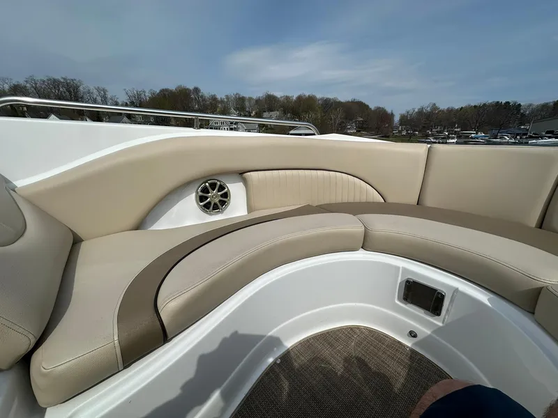 Slide: The Image of 2014 Cruisers Sport Series 278 Bow Rider interior with beige seating and speaker. - 14