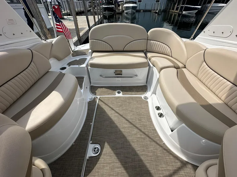 Slide: The Image of 2014 Cruisers Sport Series 278 Bow Rider with beige seating and carpeted deck. - 22