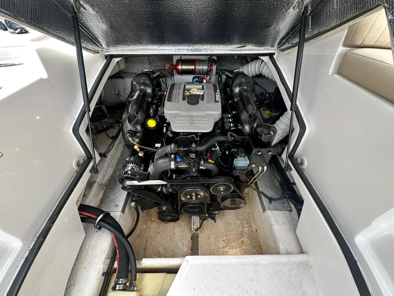 Slide: The Image of 2014 Cruisers Sport Series 278 Bow Rider engine compartment, showcasing detailed mechanical components. - 23