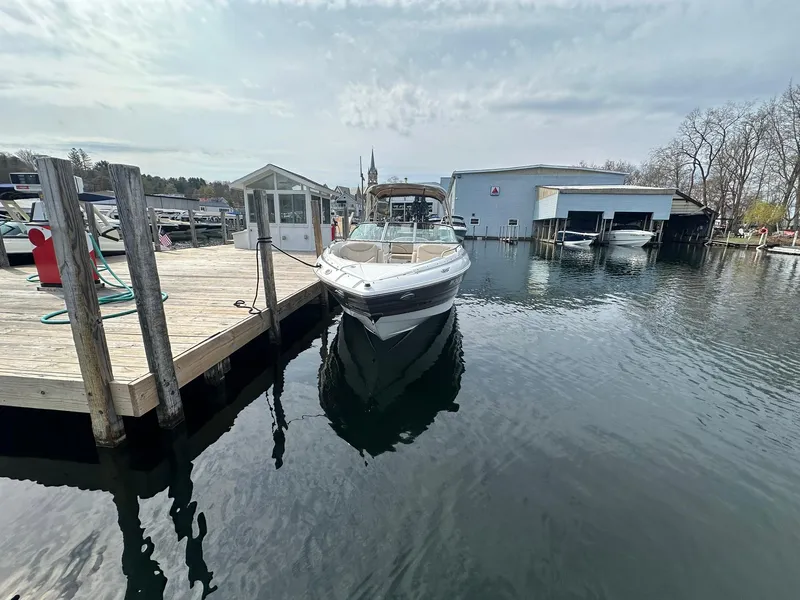 Slide: The Image of 2014 Cruisers Sport Series 278 Bow Rider docked at a marina. - 3