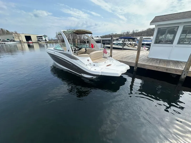 Slide: The Image of 2014 Cruisers Sport Series 278 Bow Rider docked at a marina under a partly cloudy sky. - 4
