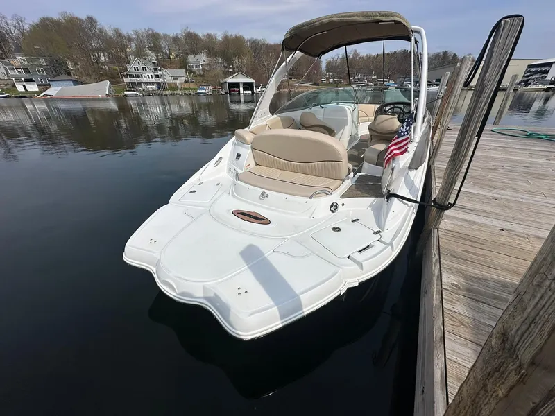 Slide: The Image of 2014 Cruisers Sport Series 278 Bow Rider docked on calm water. - 5